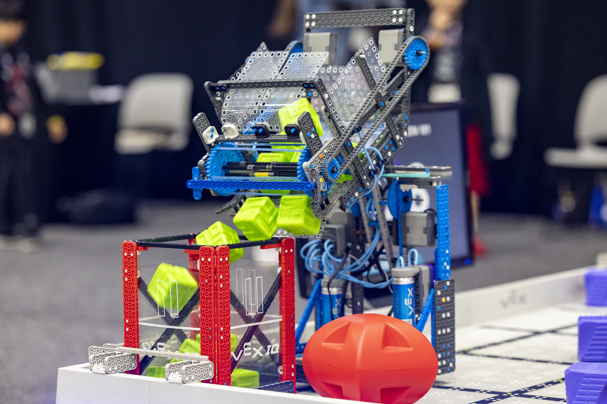 Students competing in a VEX robotics match